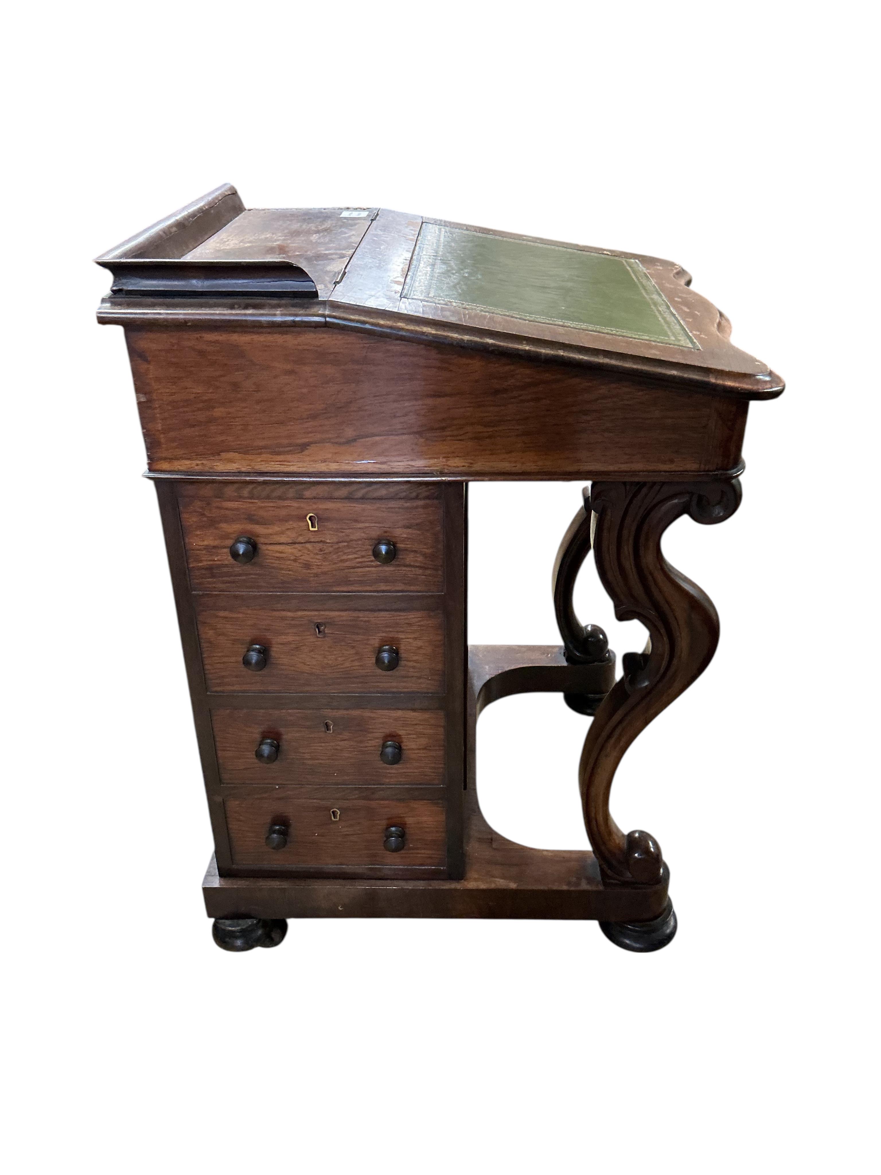 A Victorian rosewood davenport, width 54cm, depth 60cm, height 83cm